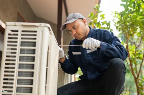 technician working on HVAC unit