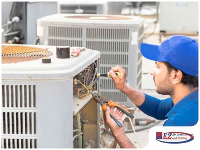 HVAC technician repairing condenser unit