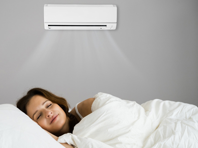 a woman sleeping comfortable with her AC on