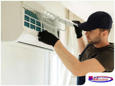 technician installing or servicing a mini-split air conditioning unit