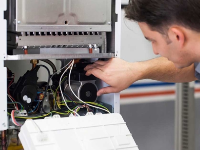 a professional technician doing an inspection of the unit