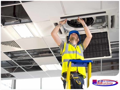 person inspecting an attic return air vent or air handler access panel