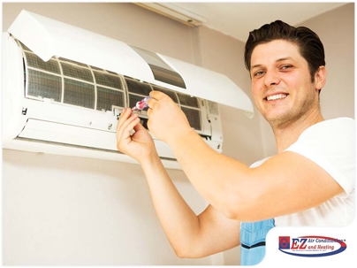 HVAC technician repairing AC