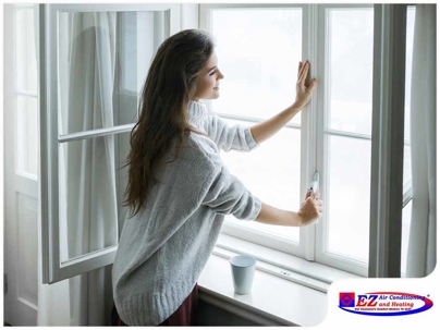 Woman beside the window