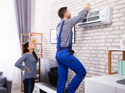 a professional technician checking the AC filters
