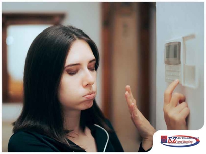 Woman pressing on the ac remote