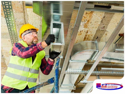 HVAC technician working on sheet metal ductwork installation