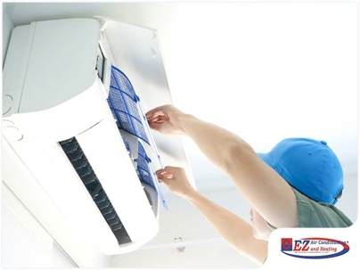 technician repairing HVAC System